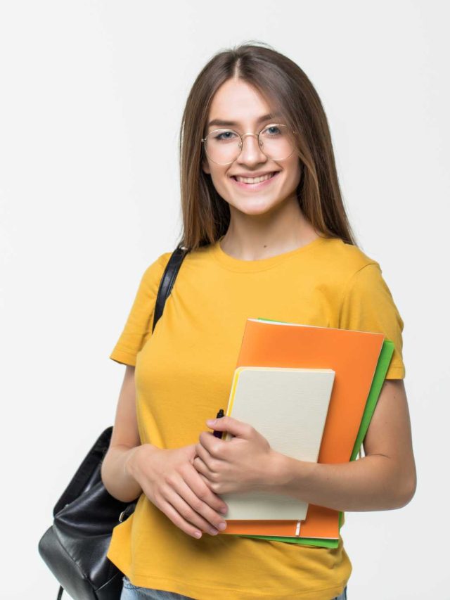 friendly-confident-woman-writing-her-organizer-isolated-white-wall (1)