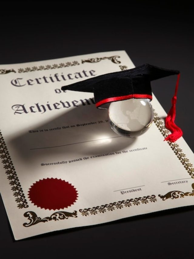 [freepicdownloader.com]-close-up-mortarboard-certificate-with-glass-globe-black-background-normal