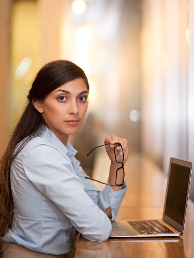 cropped-serious-attractive-woman-working-laptop-cafe-1.jpg